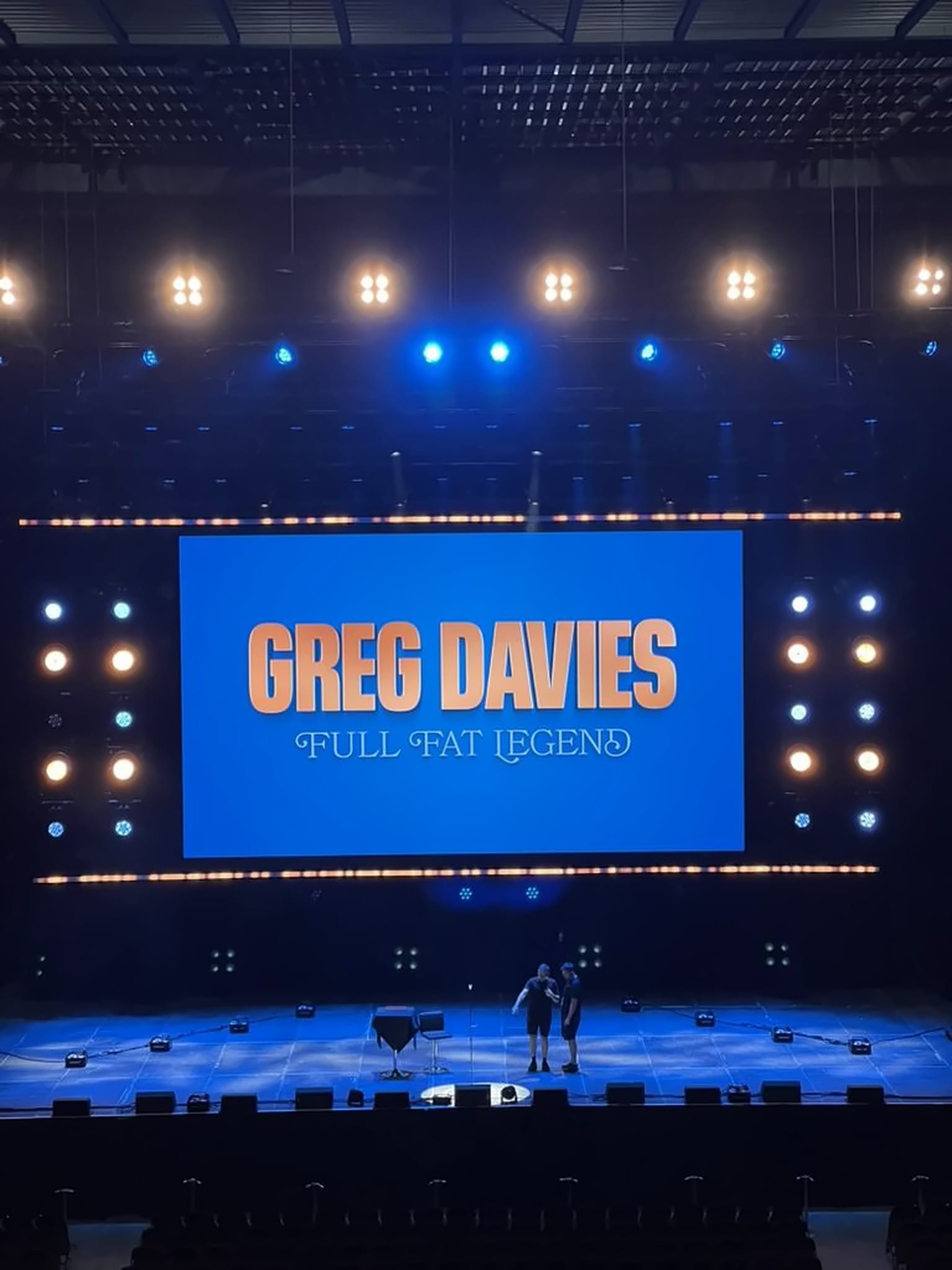 Stage LED reading Greg Davies Full Fat Legend, 2025.