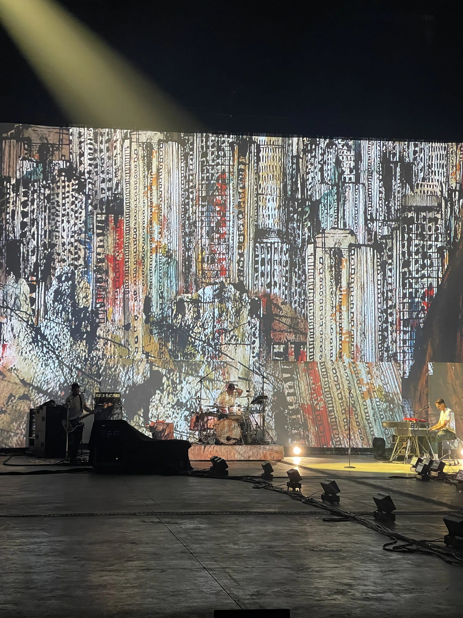 Band on stage in front of a city-skyline LED wall, Keane Hopes and Fears UK Arena Tour 2024.
